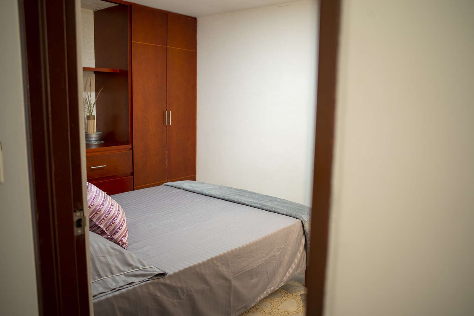 Bedroom with built-in wooden storage