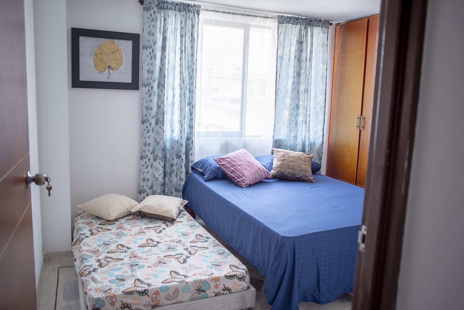 Bedroom arranged with two beds