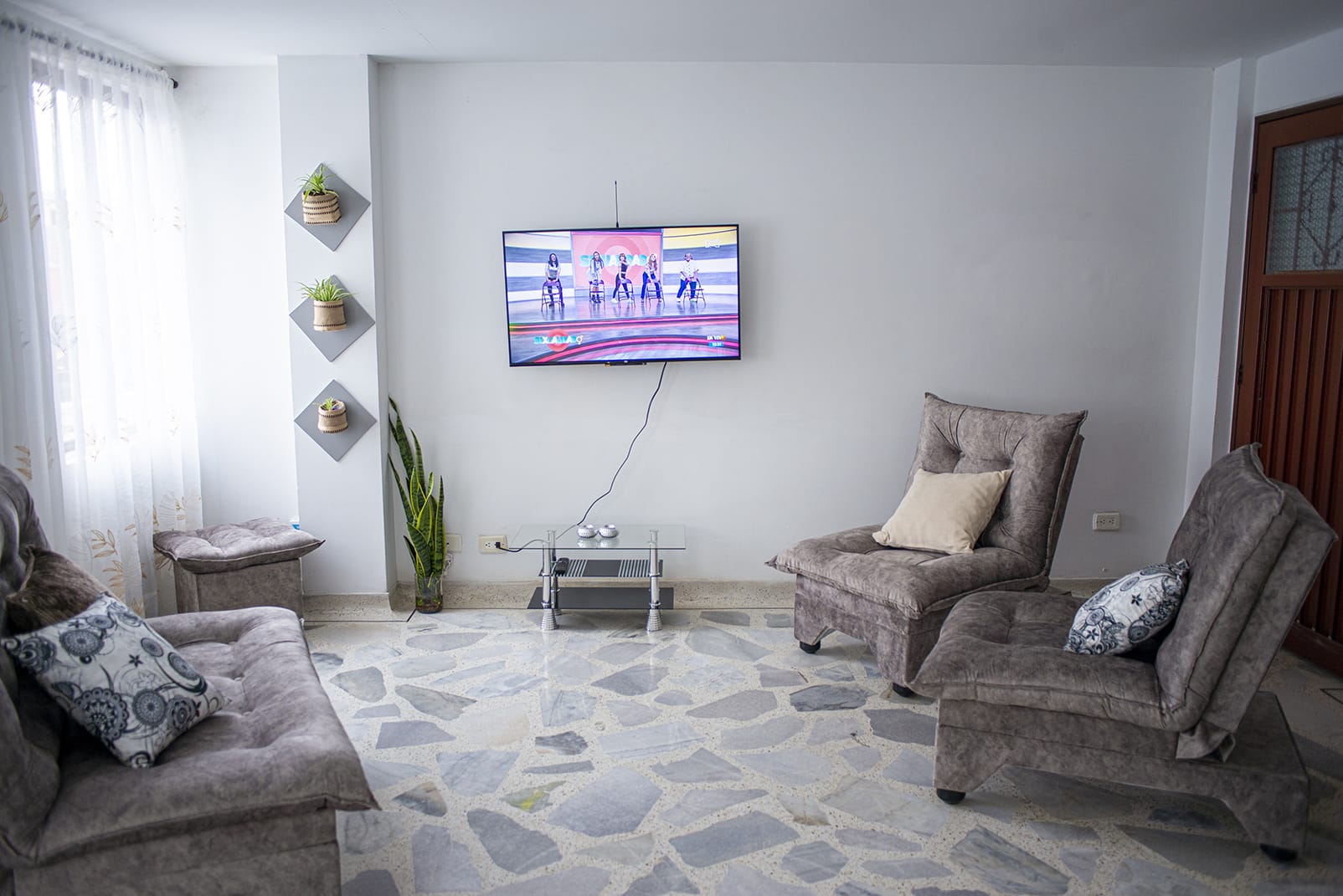 Quiet living area with television and comfortable seating